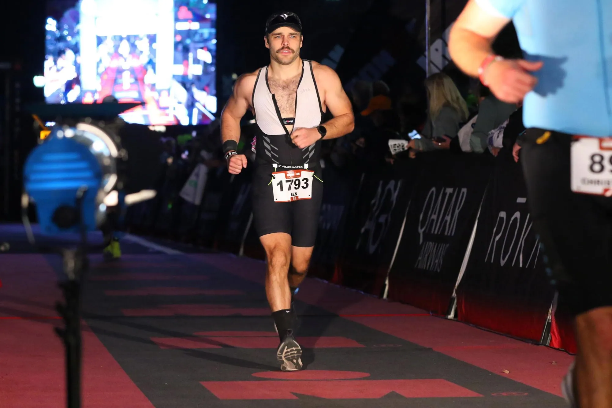 Ben crossing the Ironman Arizona finish line